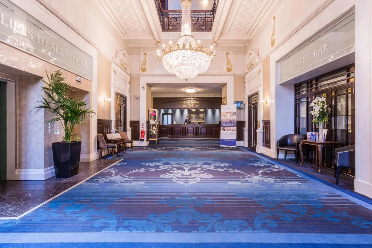 Grand hallway with blue carpet at Royal Station Hotel, Newcastle upon Tyne