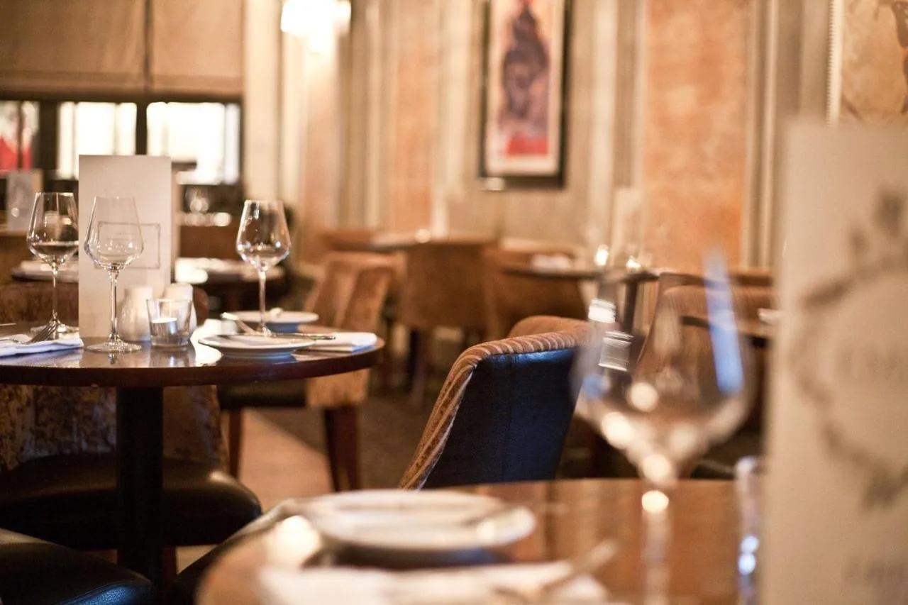 Restaurant table setting with wine glasses at Royal Station Hotel, Newcastle upon Tyne